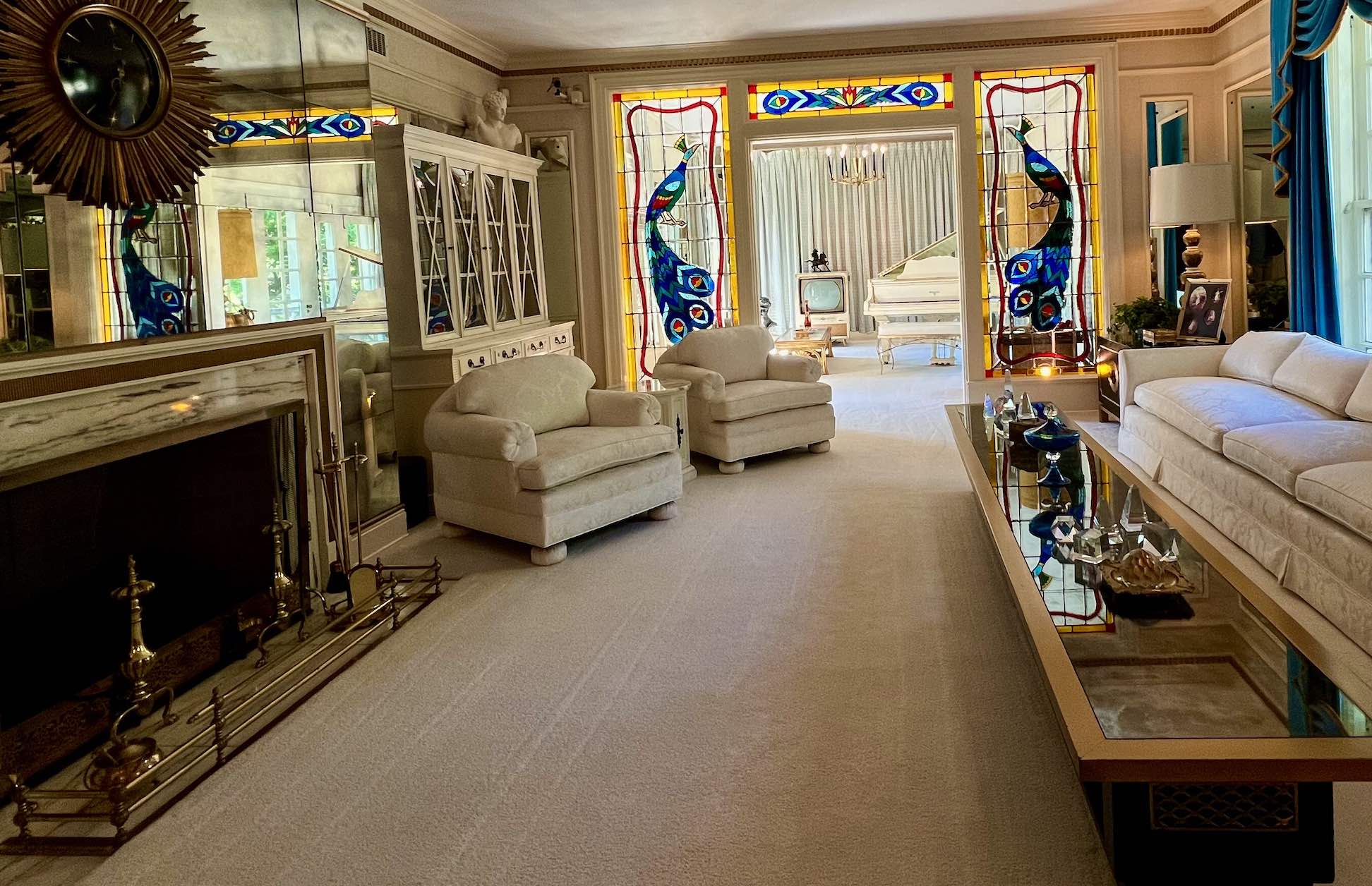 Elvis's living room with peacocks and a fabulous piano.