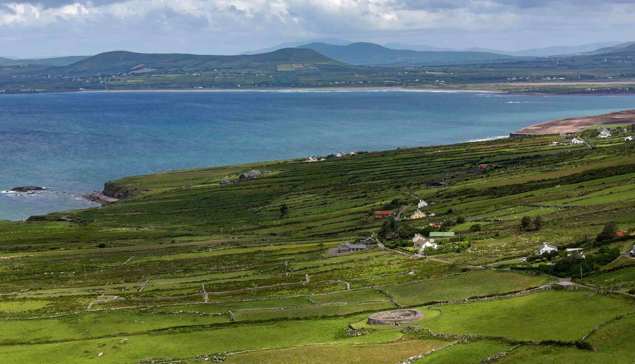 As you traverse the Ring of Kerry, experience the best of Irish culture and natural beauty. Stop by quaint villages like Kenmare, Waterville, and Sneem, and explore ancient sites such as the Staigue stone fort and Derrynane House, the former home of Irish politician Daniel O'Connell.